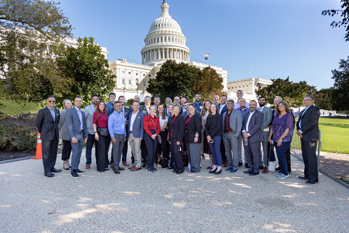 Health AI Summit participants gathered in front of the U.S. Capitol
