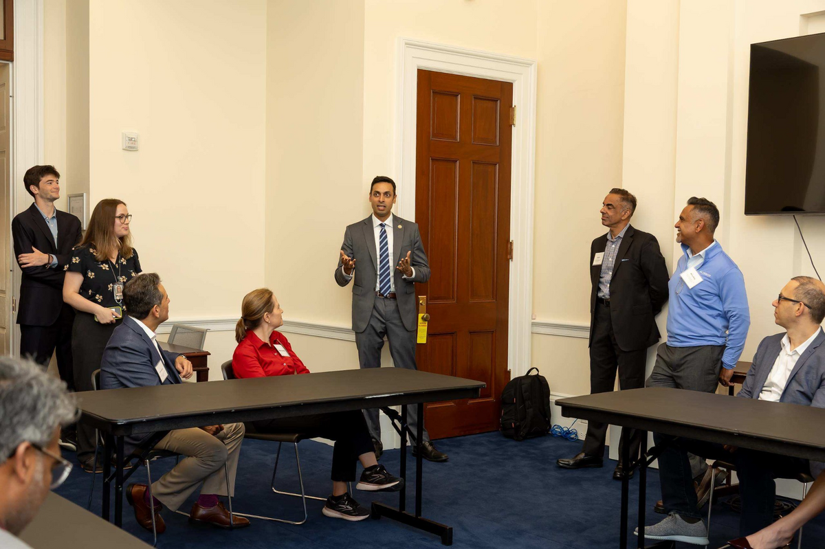Panelists and attendees exchanging ideas during a working session